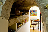 Traditional kitchen furnishings with rustic crockery shelves