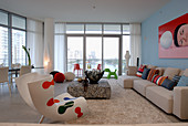 Bright living room interior with bold accents of colour and view of Miami through large windows