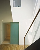 Sunny stairwell and glass partition in front of hall