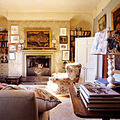 Traditionally furnished living room with bookshelves and fireplace
