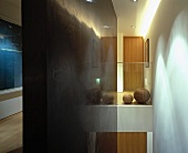 View from landing - reflections in black side wall, spherical vessels behind glass balustrade and sea-blue photograph