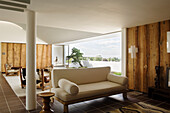 Living room with wood panelling and panoramic view