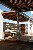 Terrace area with wooden deck and pergola, lounge corner