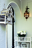 White hydrangeas, lamp and vintage birdcage