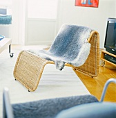 Wicker couch with fur throw in living room