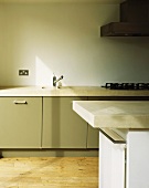 A kitchen with an island counter