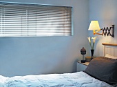 Bedroom with blinds on window