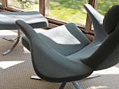 Designer armchair with footstool