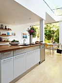 Kitchen island in open-plan kitchen of contemporary house