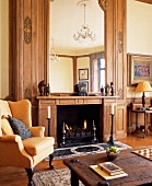 Fireplace with made-to-measure wood panelling and integrated mirror in grand parlour