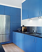 Modern kitchen with bold blue cupboard doors