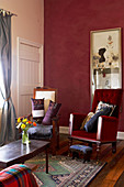 Antique reading chairs in traditional living room with pastel walls
