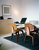 50s style wooden chairs around a table