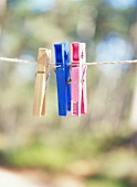 Clothes pins in assorted colors on the clothes line