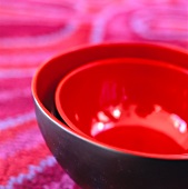A set of black and red bowls