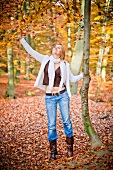 Woman in autumnal forest
