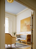 View through an open double door of a Biedermeier style sofa