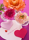 Heart decorations with Valentine's day greetings and flowers