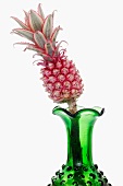 Ornamental pineapple in a green vase