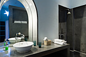 Minimalist washstand with arched mirror