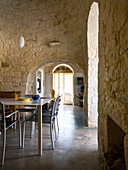 Dining room with stone vaulted ceiling in a Trullo house