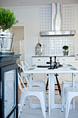 Retro-style kitchen table and metal chairs in country-house kitchen