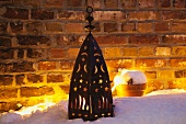 Lantern in snowy garden