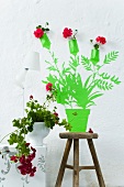 Painted flower mural with real pelargoniums