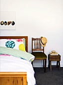 Wooden bed, chair and bedside table