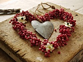 A heart of red peppercorns