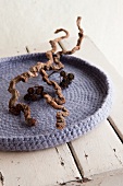 Crocheted and felted woollen dish