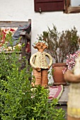 Ceramic figurine on veranda of farmhouse