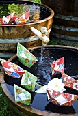 Paper boats on miniature ponds