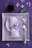 Place setting with cutlery and hydrangea flowers
