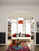 Colourful rug leads through open doorway into child's bedroom