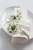 Place setting with primula flowers