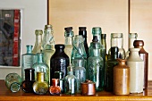 Collection of vintage bottles on wooden surface