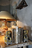 Books, bookends and lamp on wooden table