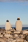 Stacks of pebbles on seaside beach