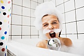 Boy singing in bubble bath