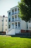 Exterior view multi level apartment building with porches