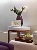 Detail vase of tulips on end table
