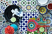 Plates and dishes on colourful tiles