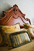 Ornate Wood Headboard and Pillows