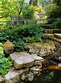 Shady garden steps between stream and hostas