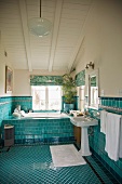 Attic bathroom with turquoise tiles