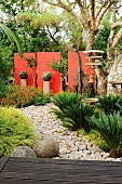 Exotic garden complex with stony path & various decorative elements