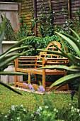 A wooden garden bench in a garden
