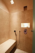 Stone tile shower with bench
