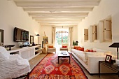 Living room with oriental rug in Spanish home